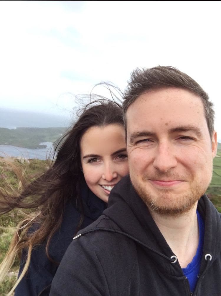 Windswept selfie of Orlaith and Niall on an Irish headland