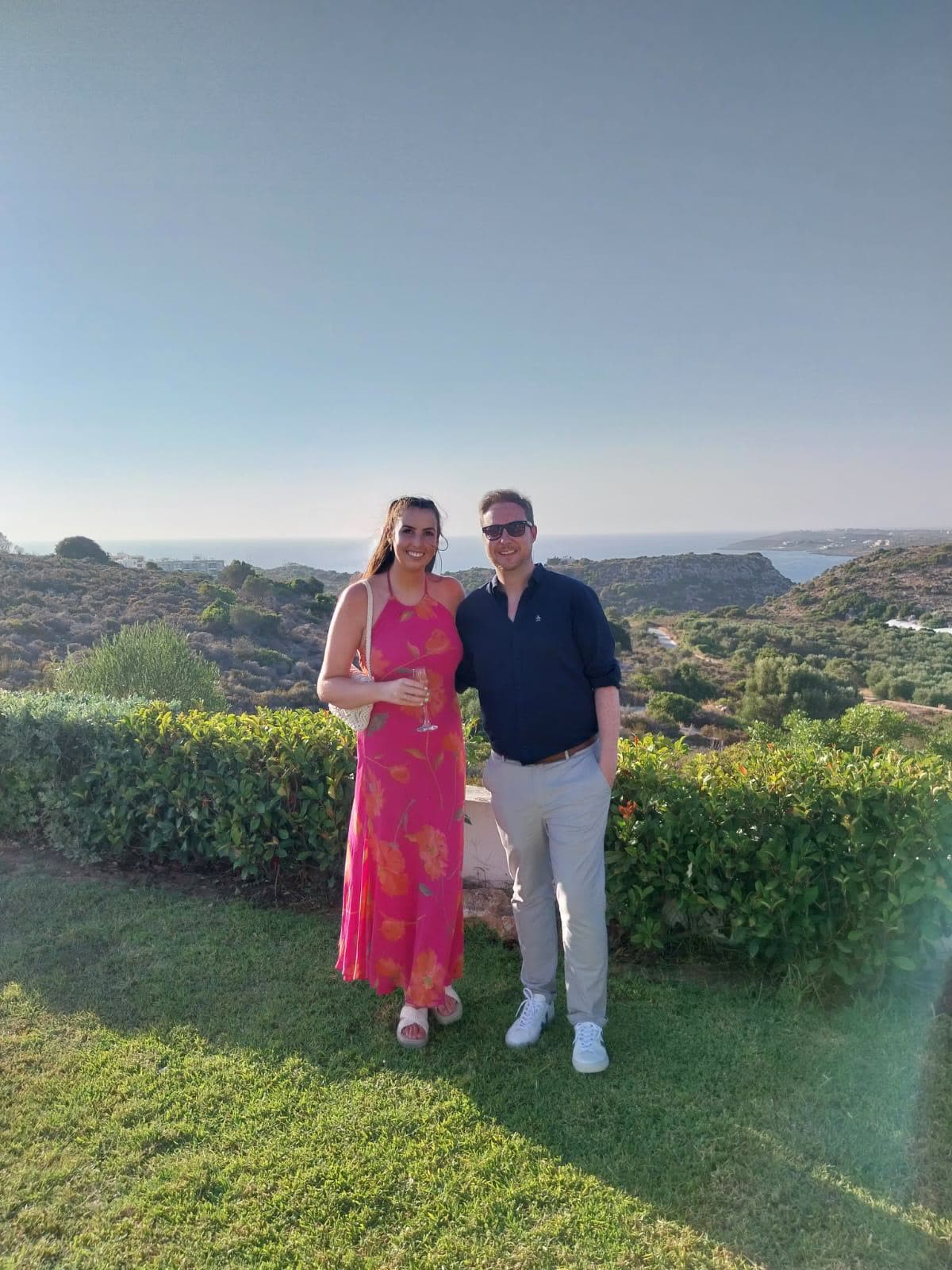 On a Greek hillside, Orlaith in a pink dress