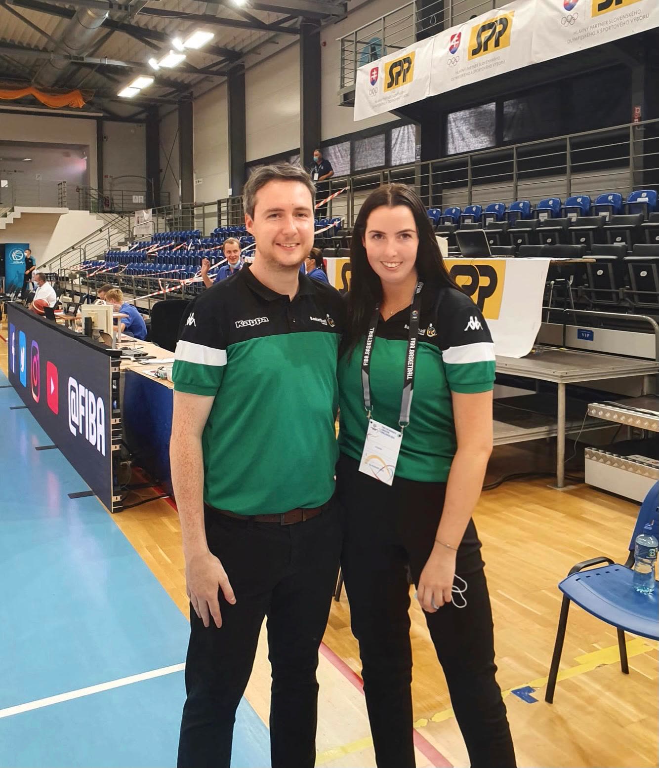 The couple at the officials' table in Basketball Ireland kit